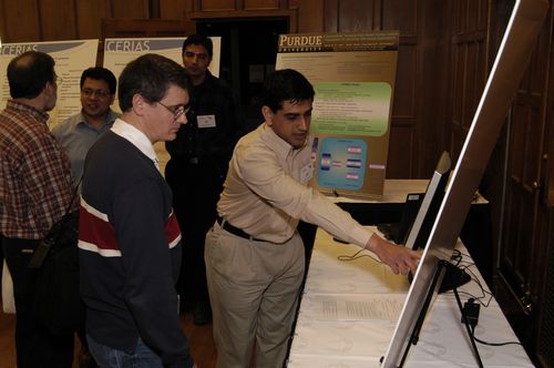 The Symposium kicked off with a poster session in which over 50 students & faculty teams presented their work and discussed their research.