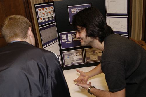 The Symposium kicked off with a poster session in which over 50 students & faculty teams presented their work and discussed their research.