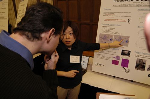 The Symposium kicked off with a poster session in which over 50 students & faculty teams presented their work and discussed their research.