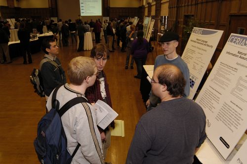 The Symposium kicked off with a poster session in which over 50 students & faculty teams presented their work and discussed their research.