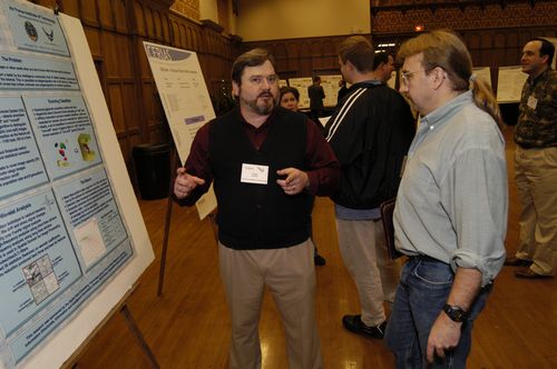 The Symposium kicked off with a poster session in which over 50 students & faculty teams presented their work and discussed their research.