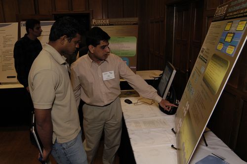 The Symposium kicked off with a poster session in which over 50 students & faculty teams presented their work and discussed their research.