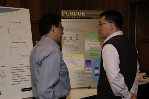 The Symposium kicked off with a poster session in which over 50 students & faculty teams presented their work and discussed their research.