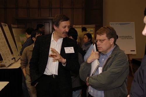 The Symposium kicked off with a poster session in which over 50 students & faculty teams presented their work and discussed their research.