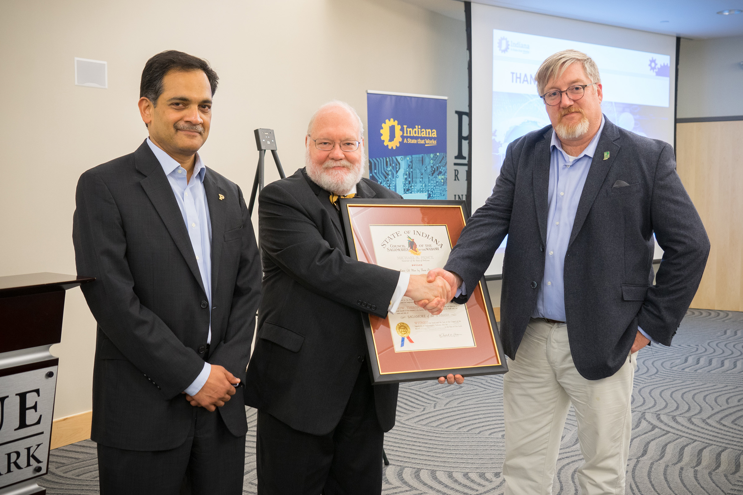 Pictured with Eugene Spafford are Suresh Garimella (left), Purdue's executive vice president for research and partnerships, and Douglas Rapp, adviser for cyber and national security initiatives at Indiana Economic Development Corporation